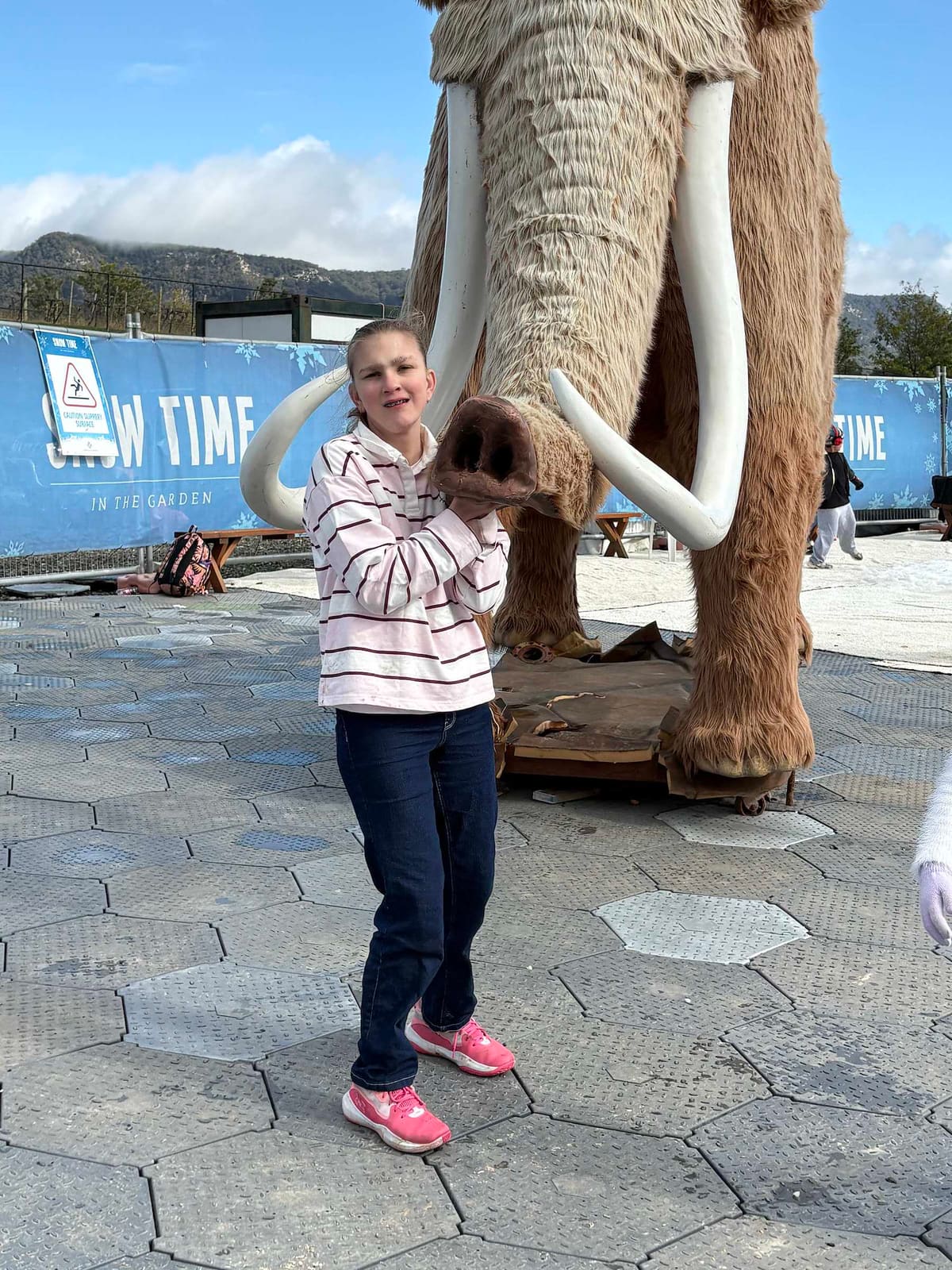 A young person on a school holiday program day out at Snow Time in the Hunter Valley Gardens
